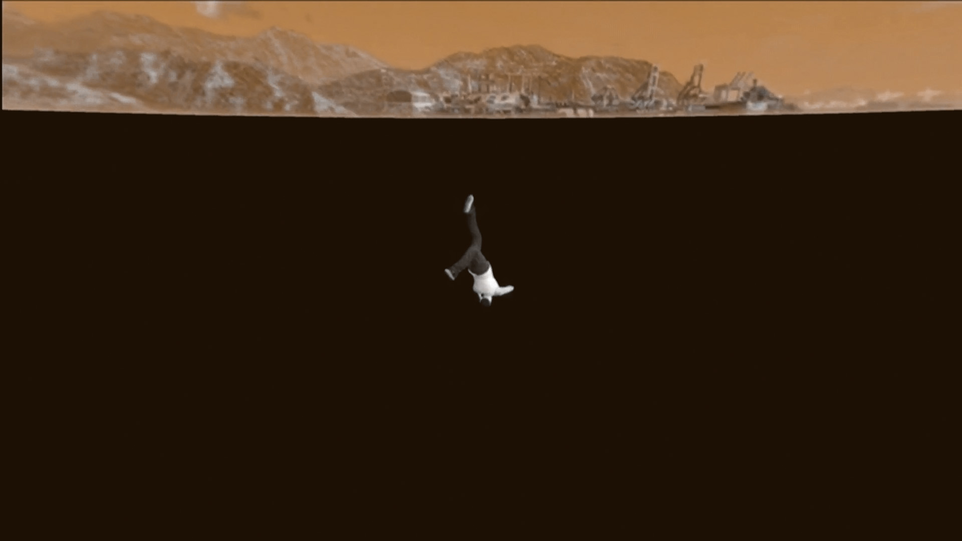 Majority black screen with a small person falling. The top of the image is a sepia sky with hills